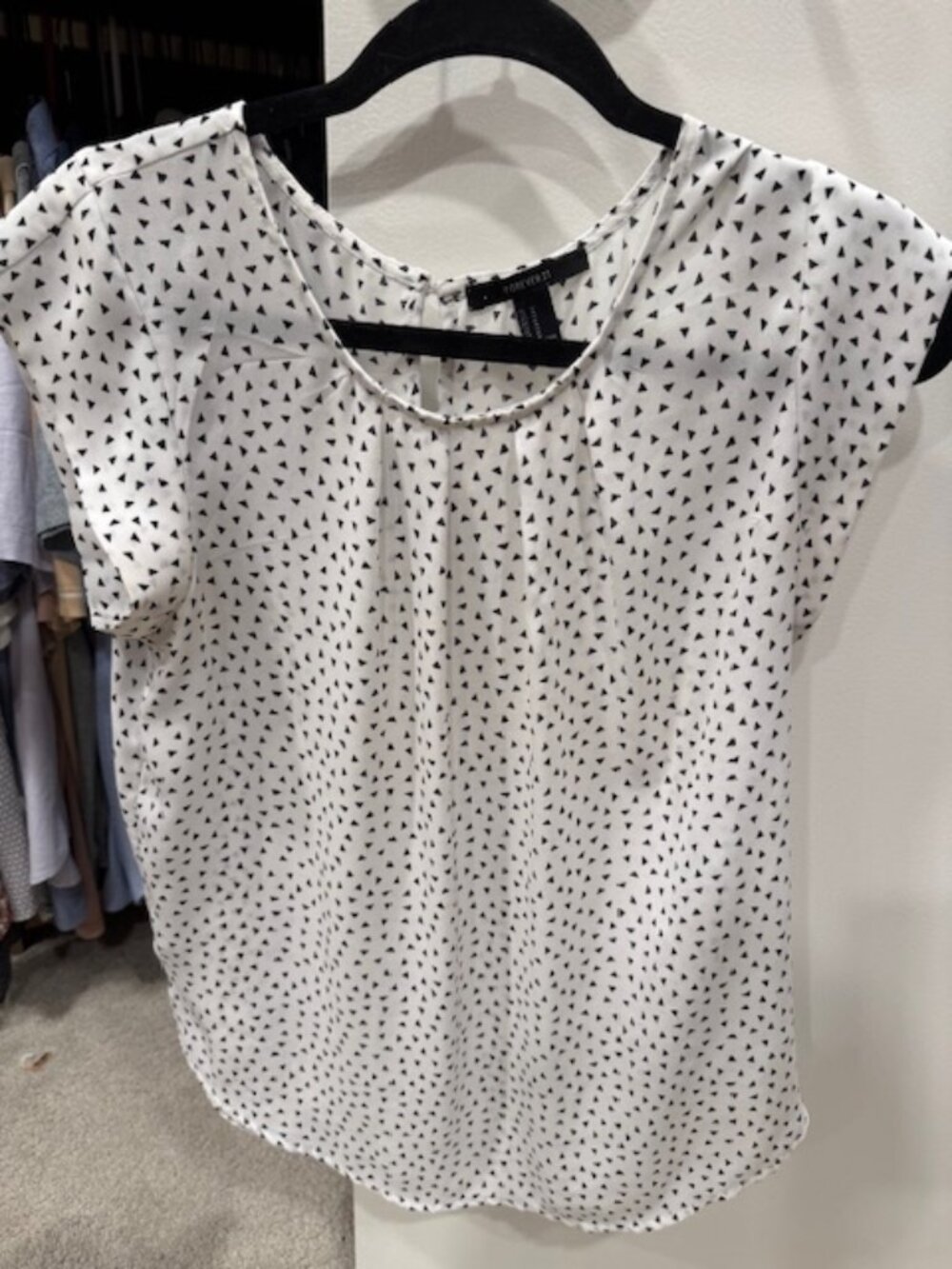 White shirt with black mini triangles